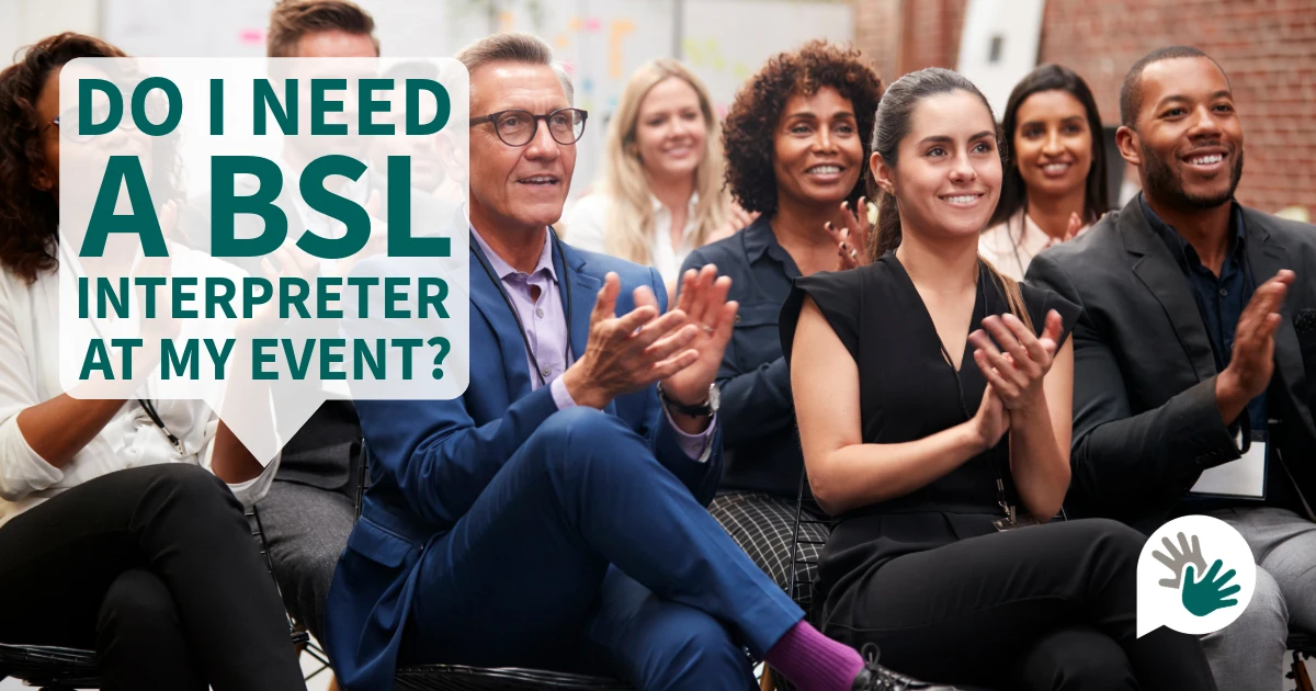 Audience applauding at an event with text reading ‘Do I need a BSL interpreter at my event?